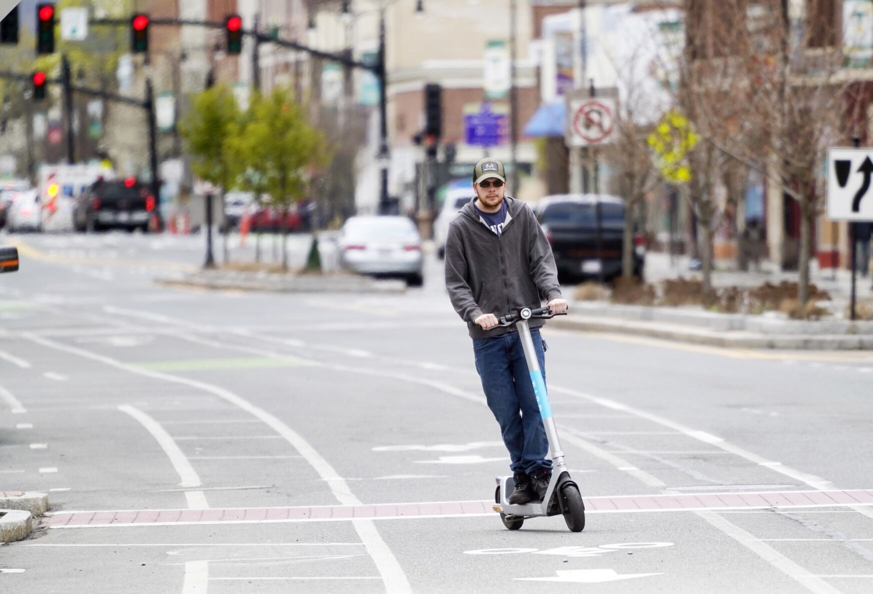 Man rides e-scooter